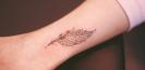 idee_tatouage_plume_tattoo